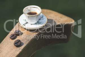 Cup of coffee on wooden table.