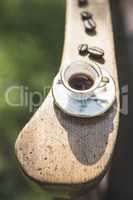 Cup of coffee on wooden table.