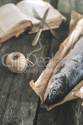 Raw salmon fish on vintage wooden table