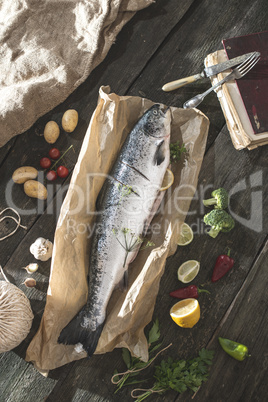 Preparing whole salmon fish for cooking