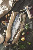 Preparing whole salmon fish for cooking