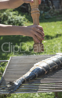 Raw salmon fish on grill