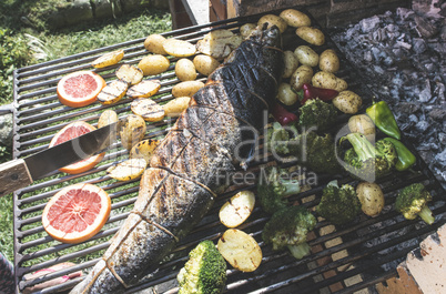 Roasting salmon fish on grill