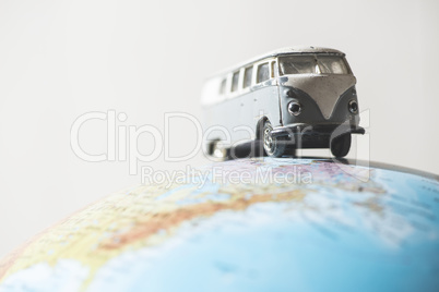 Vintage VW bus on globe