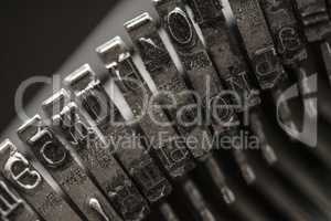 Metal letters on typewriter