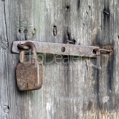 Doors locked with rusty padlock