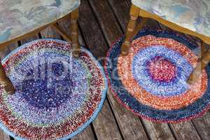 Two handmade colorful rugs