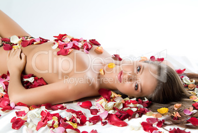 Young Woman And Rose Petals