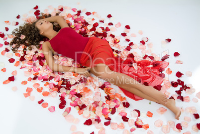 Young Woman And Rose Petals