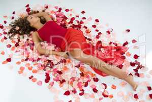 Young Woman And Rose Petals