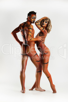 Young Woman And Man In Tiger's Body Art