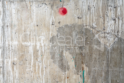 Weathered damaged wall with red dot