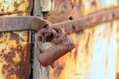 rust lock on weathered door