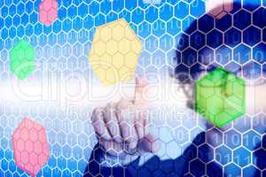 Woman in front of a virtual wall with colored hexagons