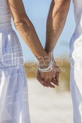 Couple Holding Hands on An Empty Beach