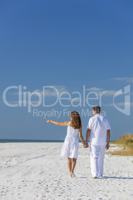 Man Woman Couple Walking Pointing on Empty Beach