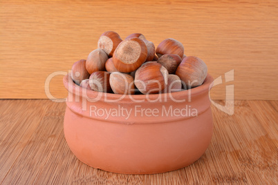 Hazelnuts in small clay pot