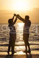 Senior Couple Holding Hands Sunset Tropical Beach