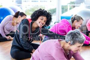 Cheerful women exercising