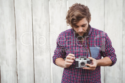 Hipster using camera