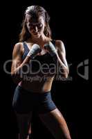 Portrait of female athlete with fighting stance