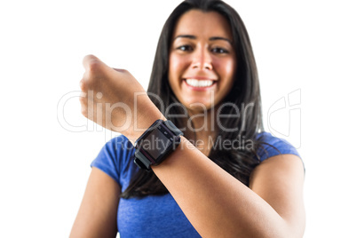 Smiling woman showing off her smartwatch