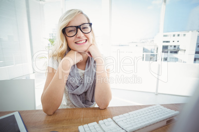 Portrait of happy woman with hand on chin