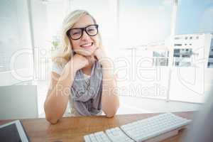 Portrait of happy woman with hand on chin