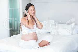 Happy woman listening on music