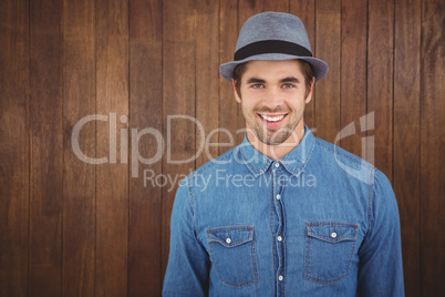 Portrait of happy hipster wearing hat