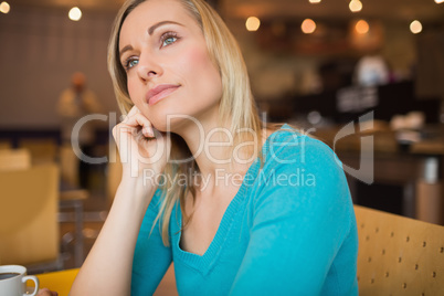 Thoughtful young woman looking away