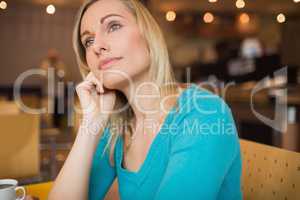 Thoughtful young woman looking away