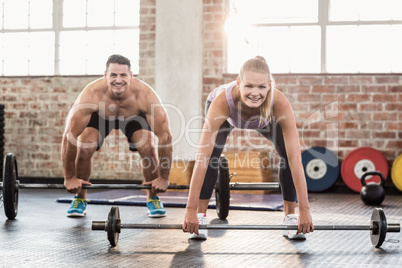 Two fit people working out
