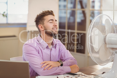 Businessman relaxing in office