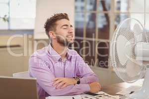 Businessman relaxing in office