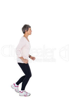 Side view of mature woman jogging