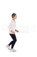 Side view of mature woman jogging