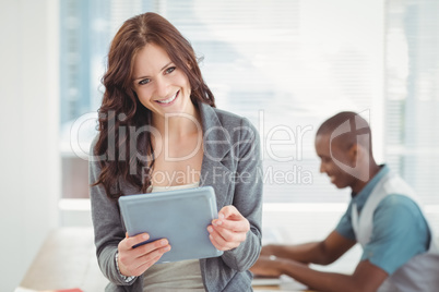 Portrait of smiling woman using digital tablet Portrait of smiling woman using digital tablet