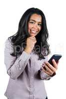 Smiling businesswoman using her smartphone