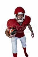 Rugby player with ball posing