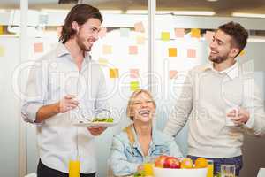 Employees having fun during breakfast