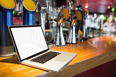 Laptop on bar counter