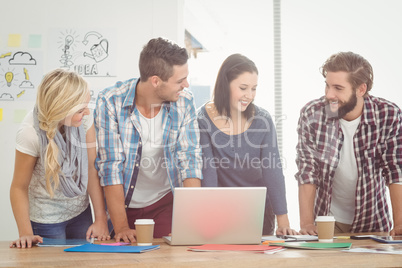 Smiling business people bending