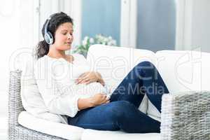 Happy woman listening to music with closed eyes