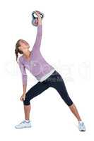 Young woman exercising with kettlebell