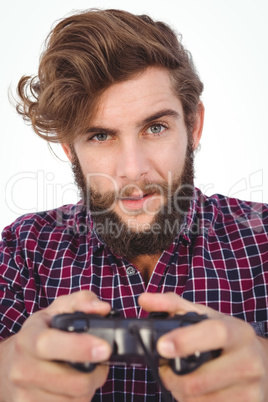 Portrait of hipster playing video game