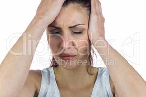 Close-up of stressed woman suffering from headache