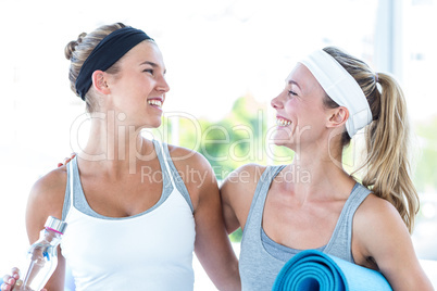 Women looking at each other and smiling