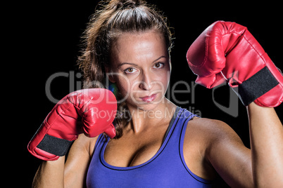 Portrait of female athlete with red gloves