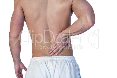 Midsection of man suffering from back pain